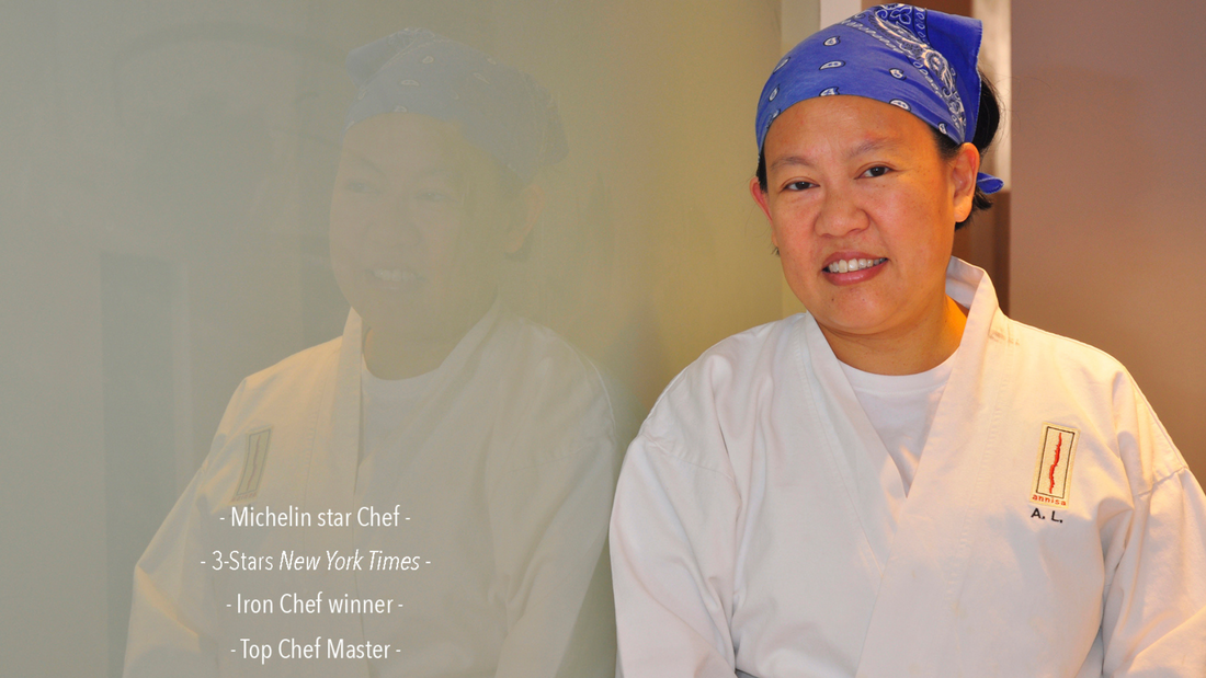 Chef Anita Lo stands against a wall with text Michelin star Chef, 3 Stars New York Times, Iron Chef winner, and Top Chef Master