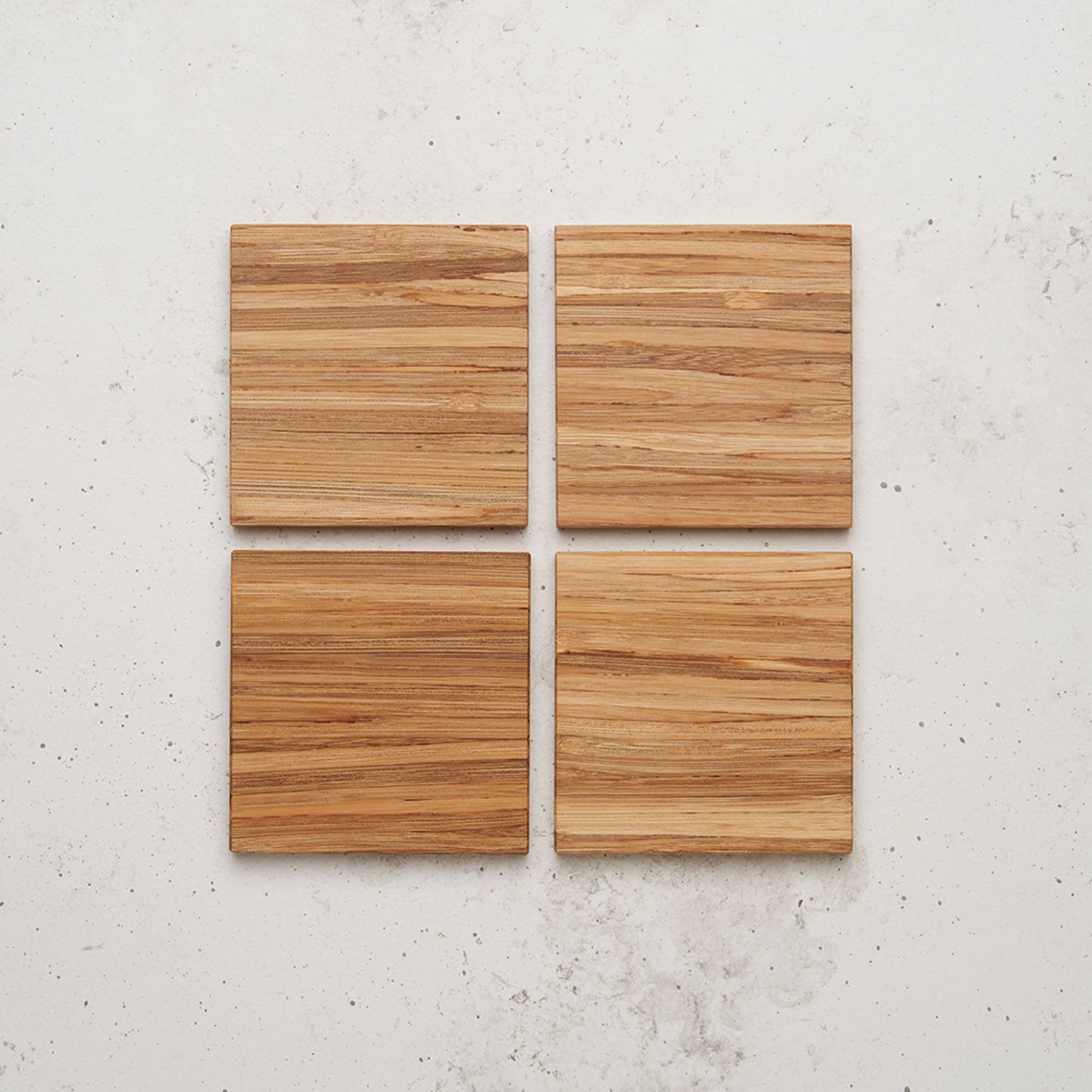 An overhead view of the entire All day Every day coaster set sitting on a counter