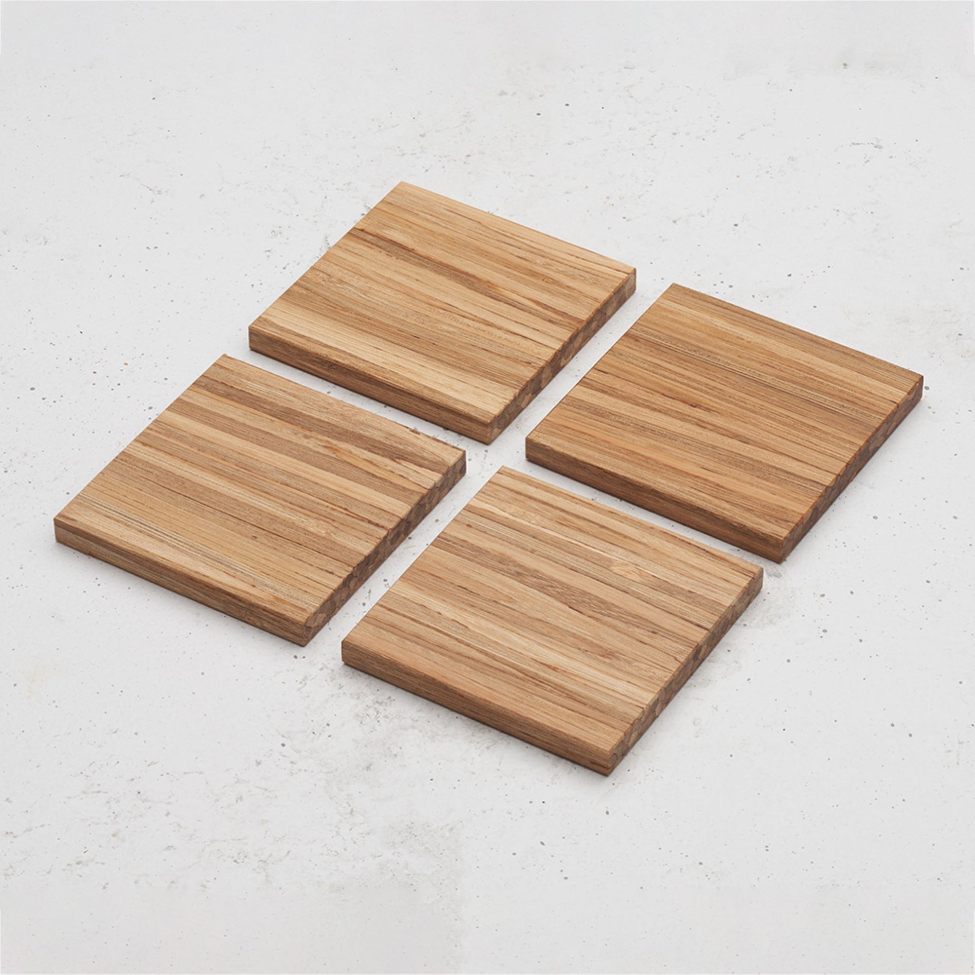 An overhead view of the entire All day Every day coaster set sitting on a counter