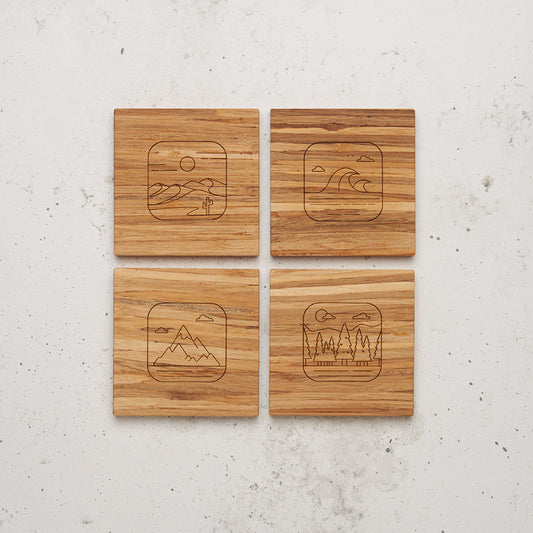 An overhead view of the entire all day every day nature themed coaster set sitting on a counter top