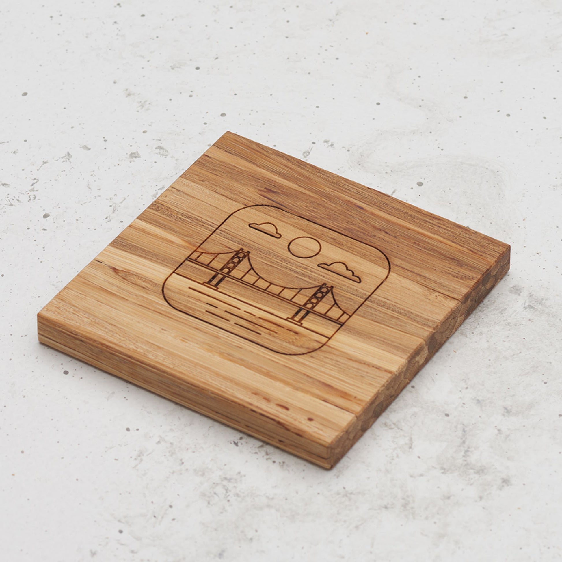 An overhead view of one of the US landmark themed all day every day coasters with the golden gate bridge engraved in the middle