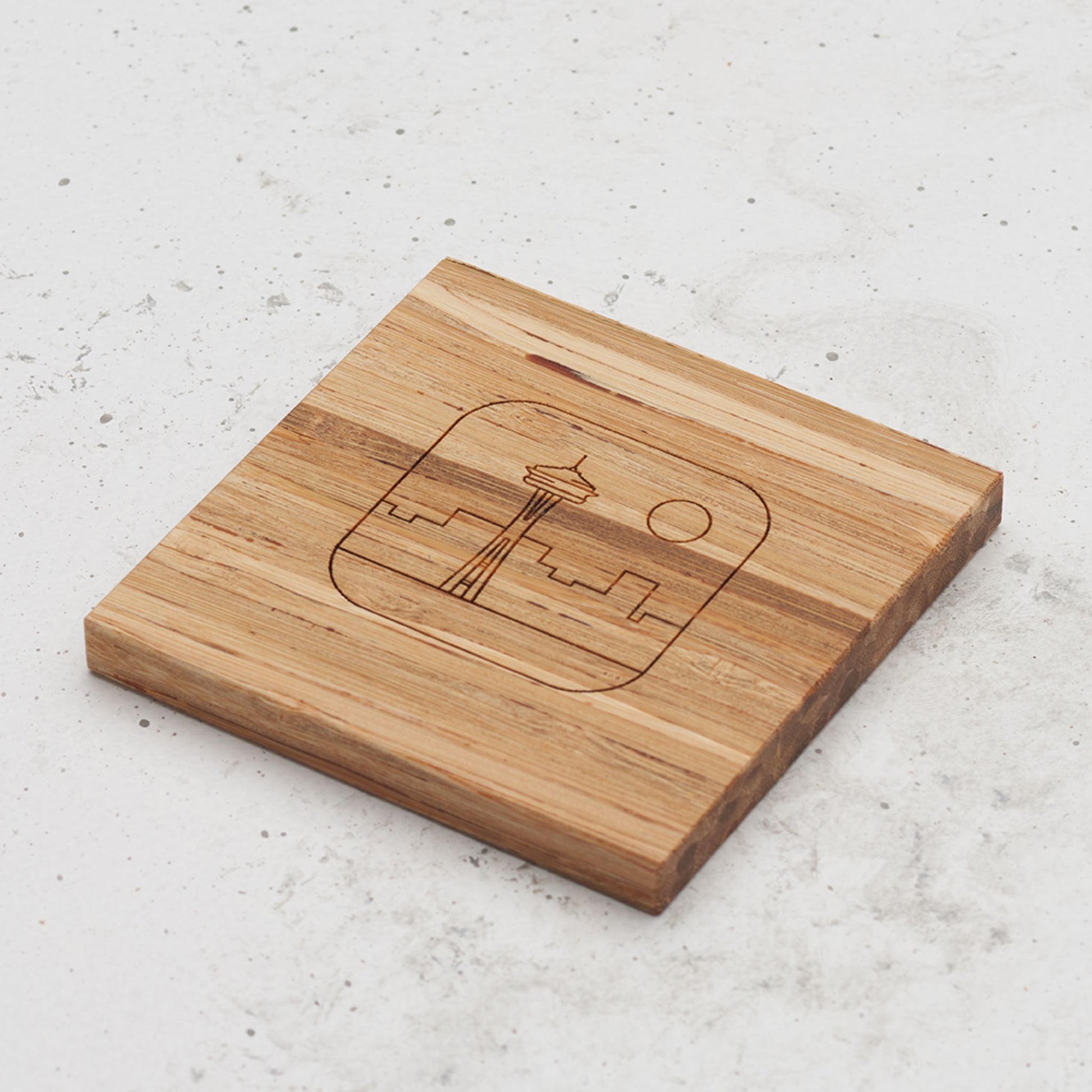 An overhead view of one of the US landmark themed all day every day coasters with the space needle engraved in the middle