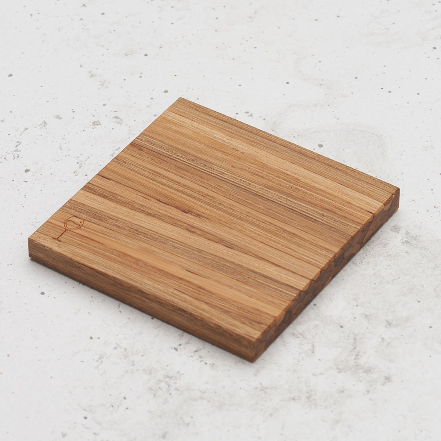 An over head view of one of the happy hour themed all day every day coasters with a wine glass featured in the bottom left corner