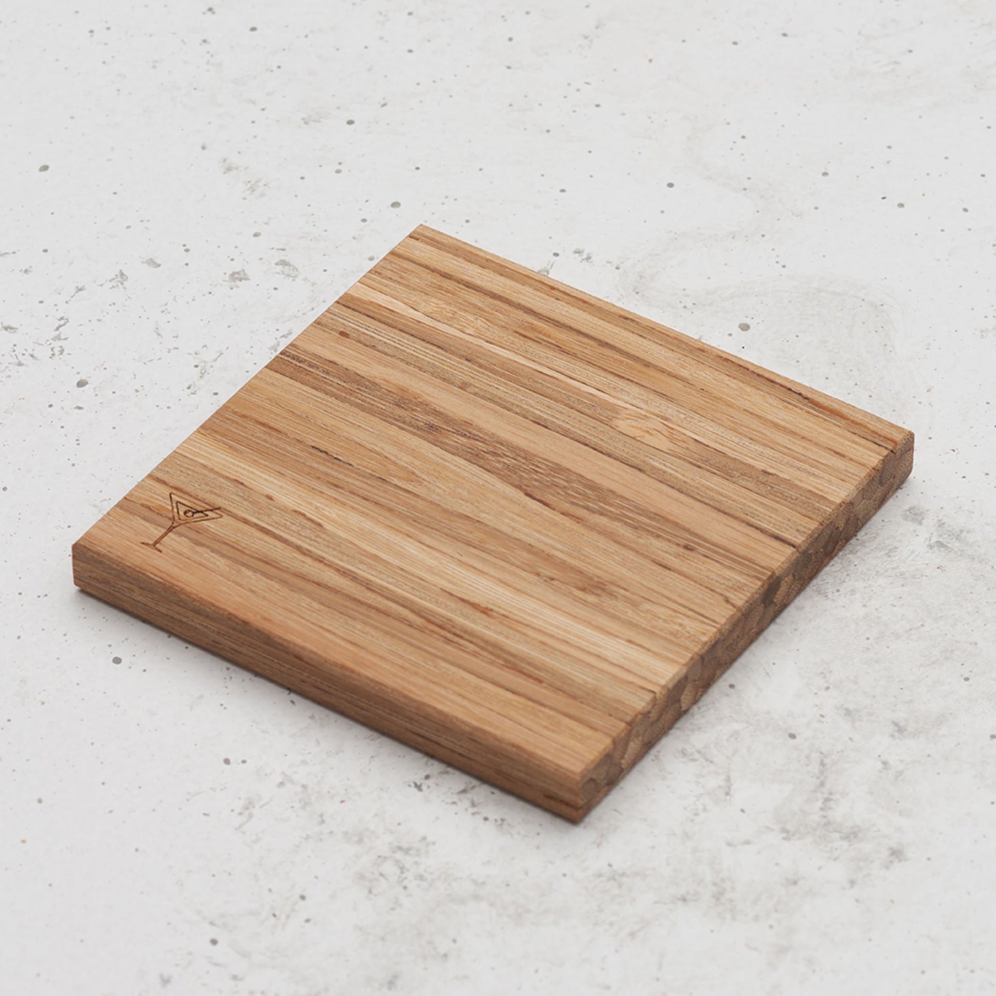 An over head view of one of the happy hour themed all day every day coasters with a martini glass featured in the bottom left corner