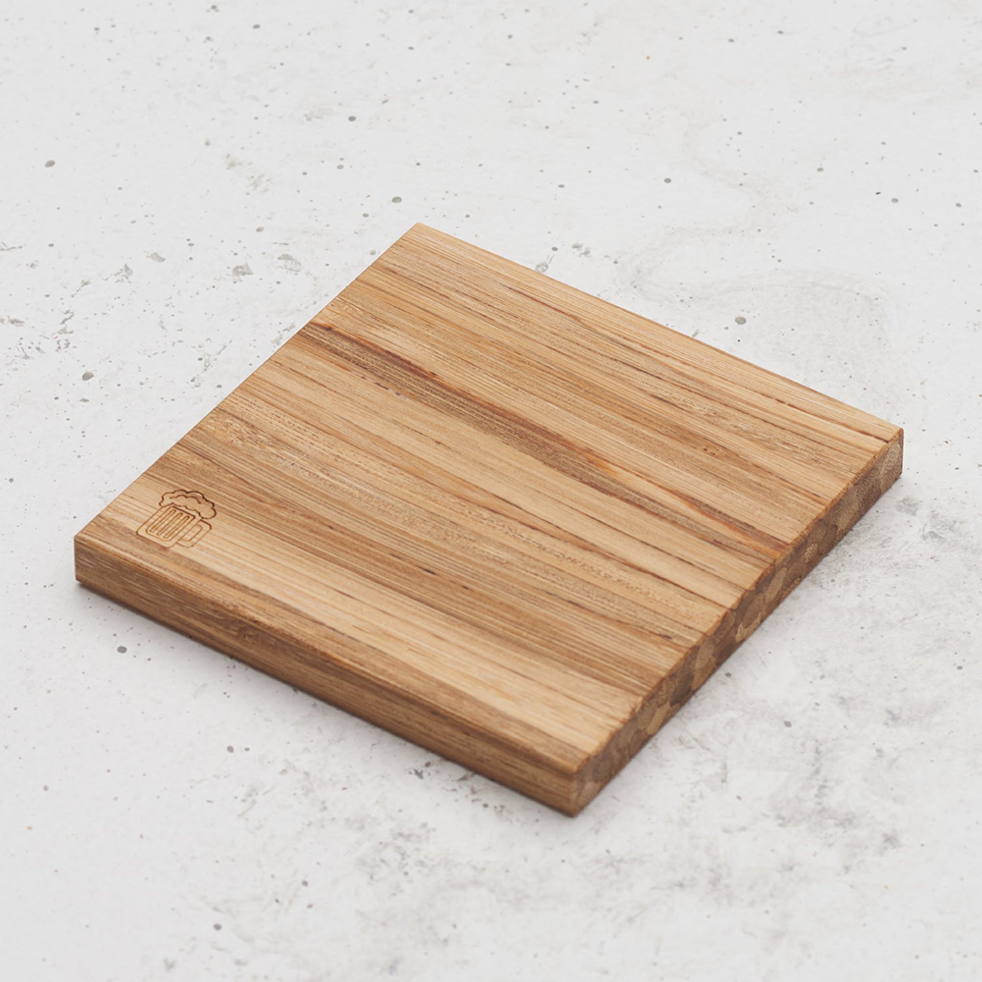 An over head view of one of the happy hour themed all day every day coasters with a beer mug featured in the bottom left corner