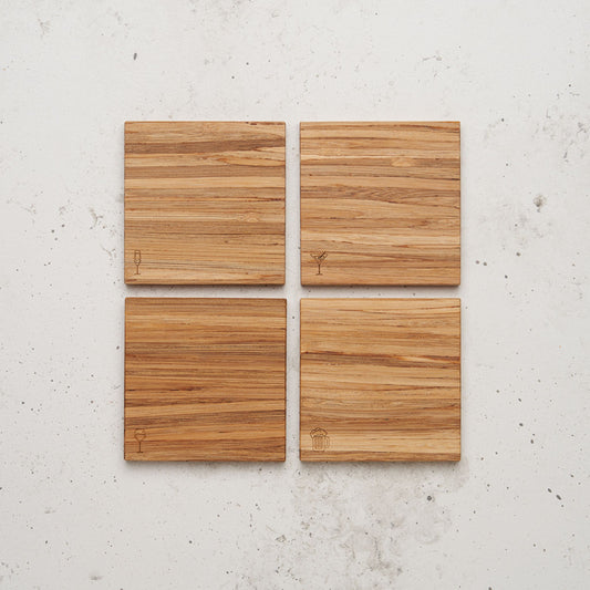 An over head view of the happy hour themed all day every day coaster set