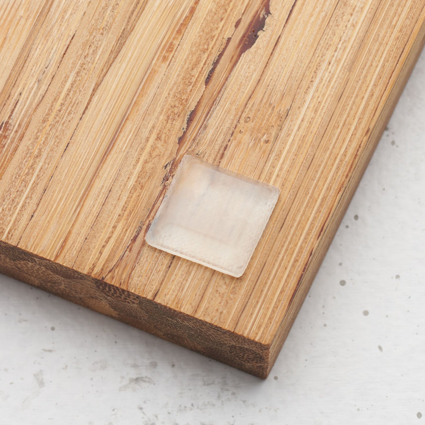 Close up view of the slip proof bumper attached to the back of the serving tray in lower corner