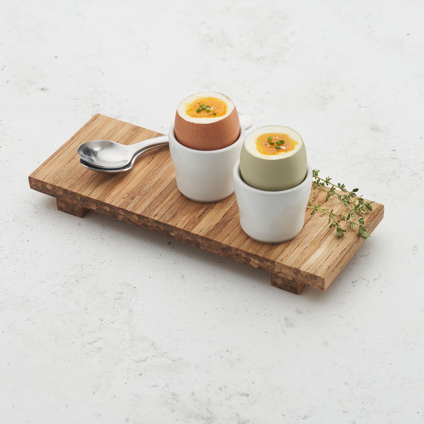 breakfast tray with two cups filled with eggs