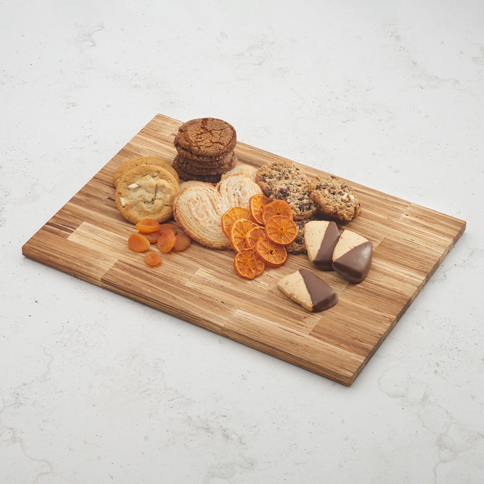 serving board with cookies and dried fruit