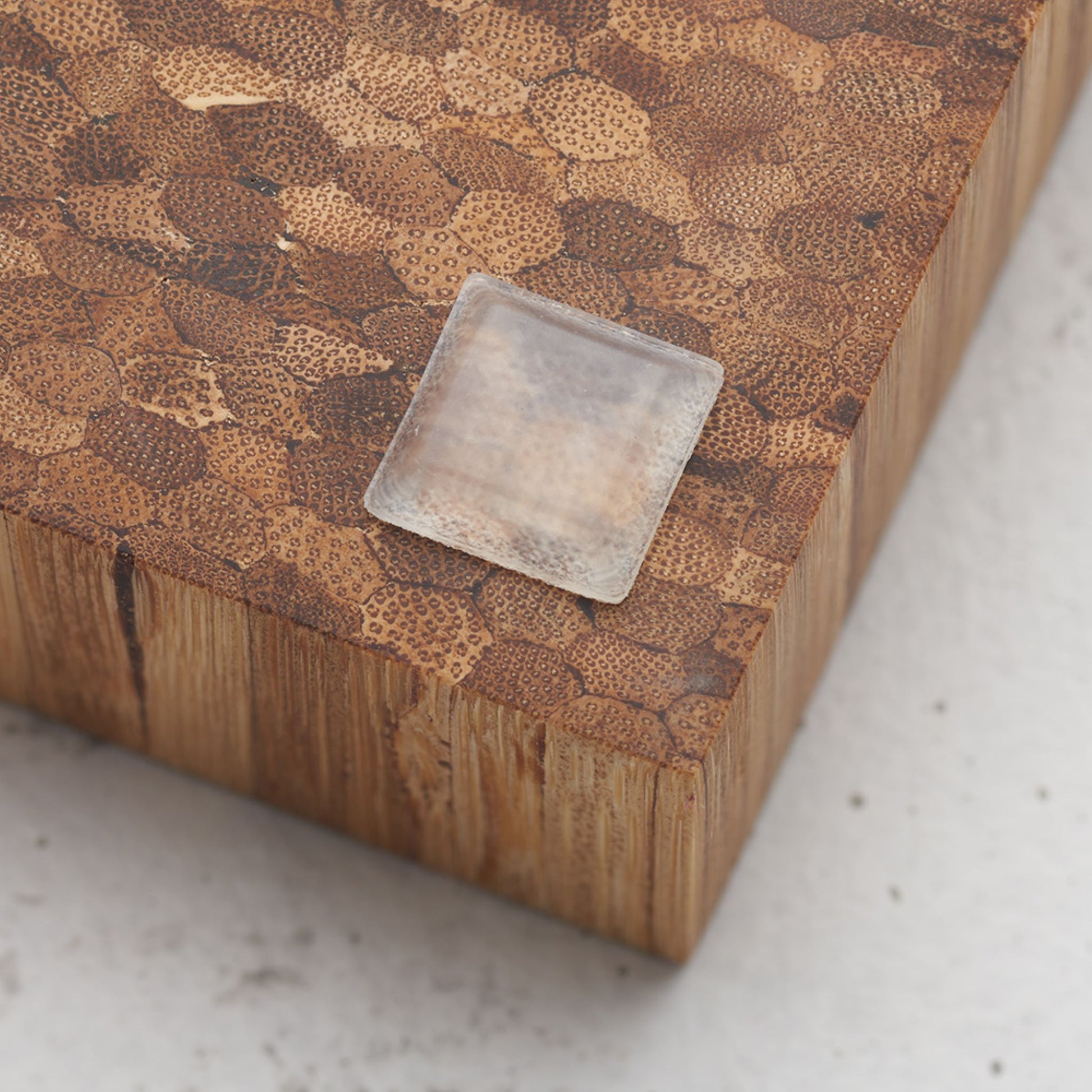 Close up view of the slip proof bumper attached to the back of the serving tray in lower corner