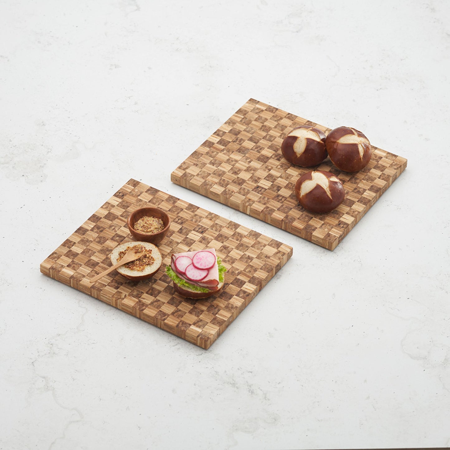 2 game day checker boards filled with charcuterie