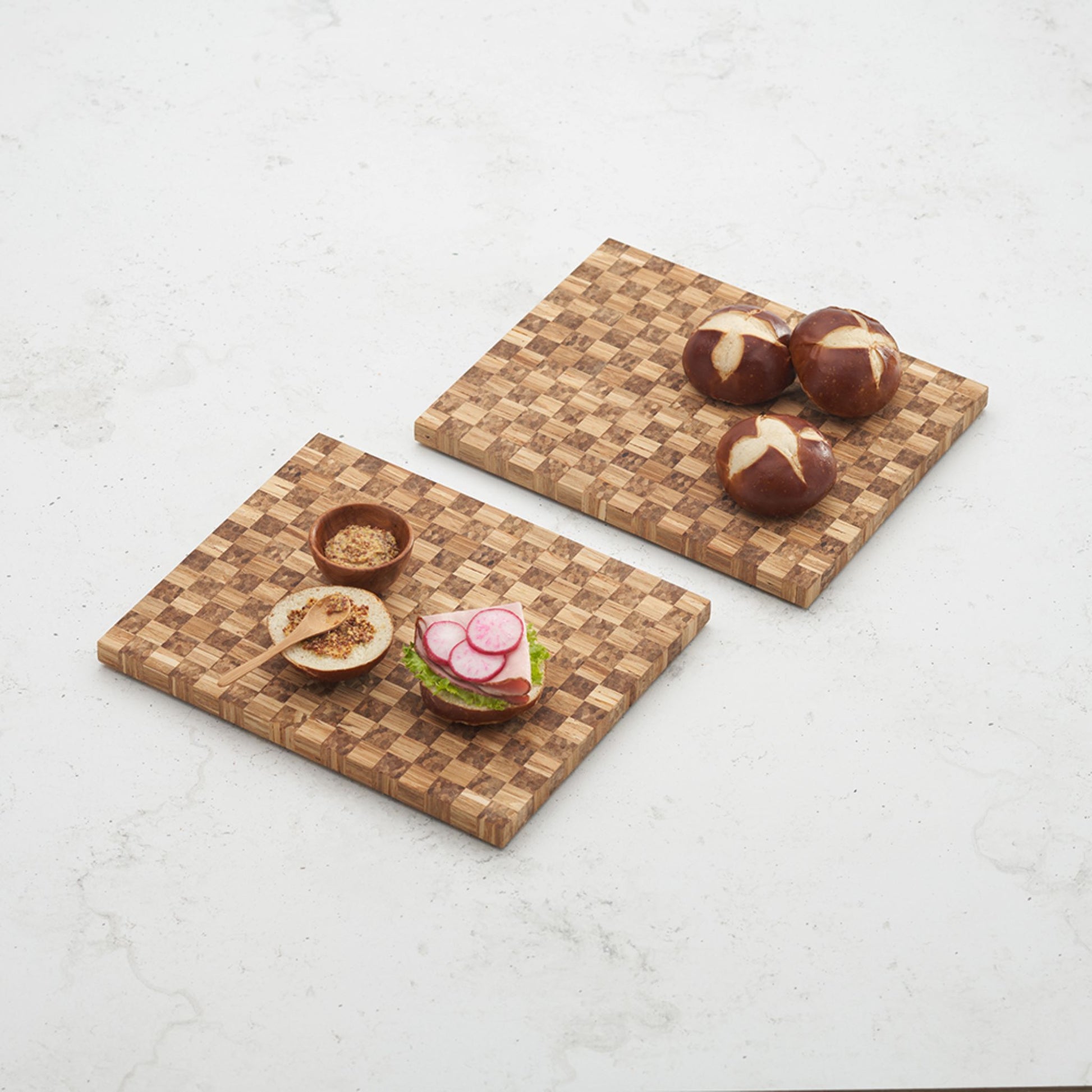 2 game day checker boards filled with charcuterie