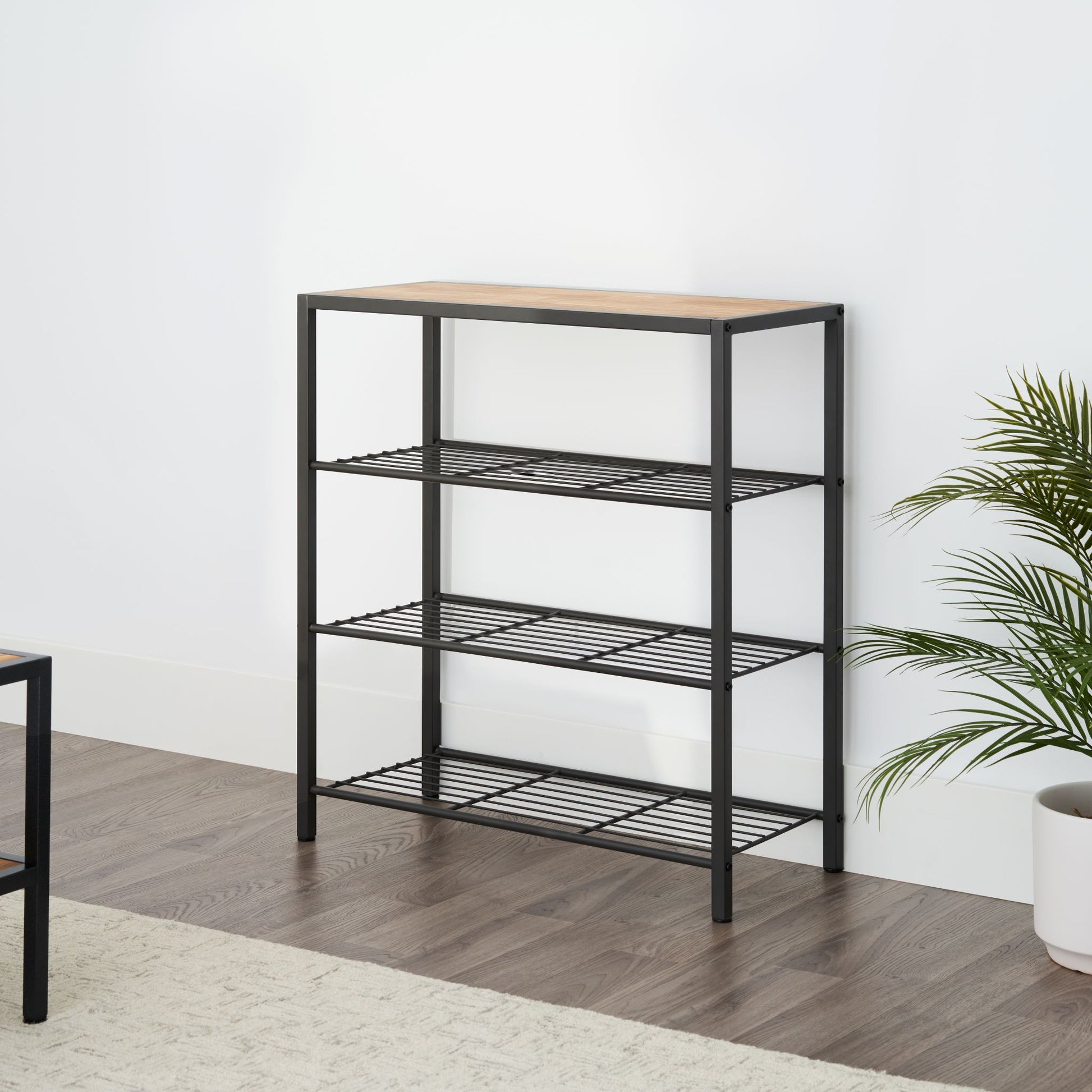 modern four tier shelving rack with chopstick wood top in a living room