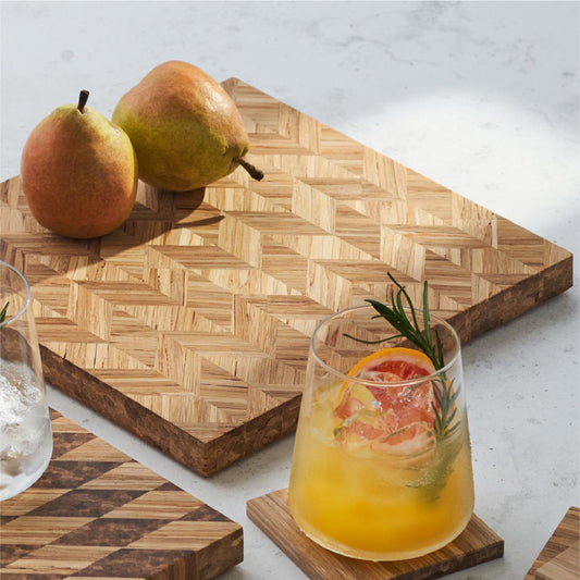 Two pears on the wine and dine serving board. A glass of cocktail on the coaster