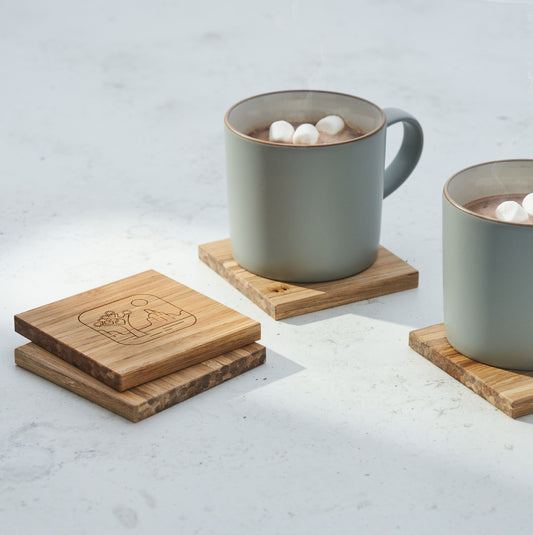 coasters and mugs of hot chocolate