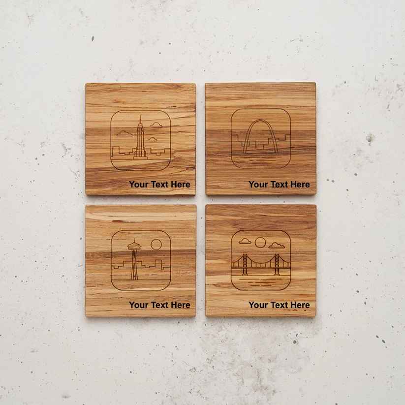 An overhead view of the backside of the entire US landmark themed all day every day coaster set sitting on a counter. The skylines represent iconic US landmarks: the Empire State Building (New York), the Gateway Arch (St. Louis), the Space Needle (Seattle), and the Golden Gate Bridge (San Francisco), with the text "Your Text Here" below each design.