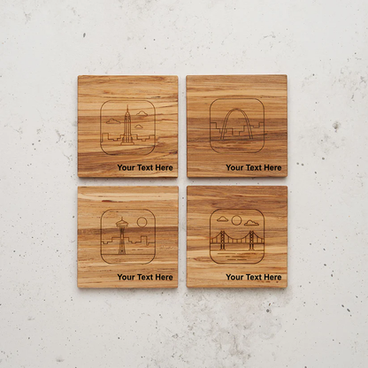 An overhead view of the backside of the entire US landmark themed all day every day coaster set sitting on a counter. The skylines represent iconic US landmarks: the Empire State Building (New York), the Gateway Arch (St. Louis), the Space Needle (Seattle), and the Golden Gate Bridge (San Francisco), with the text "Your Text Here" below each design.
