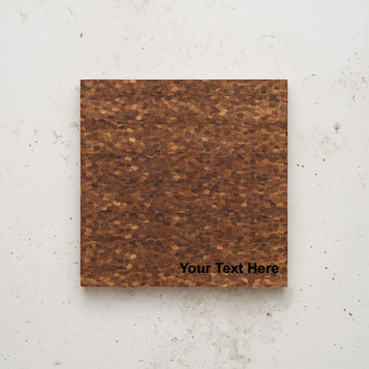 Overhead view of the care to share cheese block. The board has a distinctive end-grain pattern composed of small, irregular, honeycomb-like wood pieces, with the placeholder text "Your Text Here" in the bottom right corner.