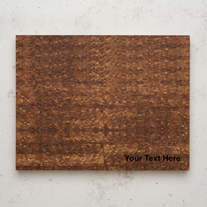 Overhead view of the large dark brown cutting board with a textured, mosaic-like grain pattern, suggesting an end-grain construction. The words "Your Text Here" are faintly overlaid in the bottom right corner of the board.