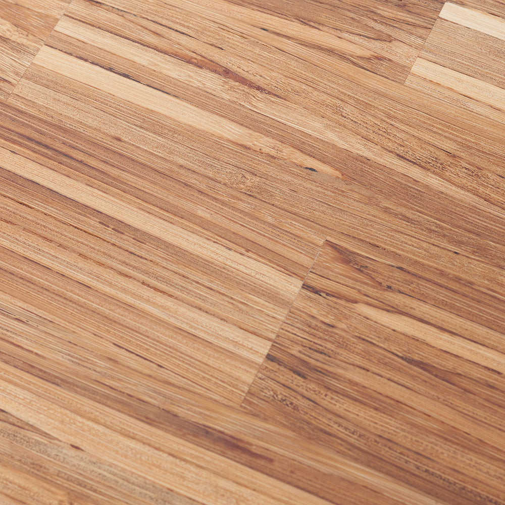 A close-up, diagonal view of warm-toned wood-look in a plank pattern. The planks display varied shades of tan and brown with distinct wood grain lines.